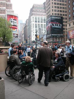 larger photo of people in wheelchairs on 34th street