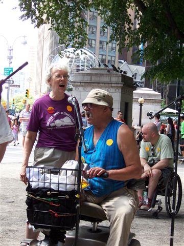 larger photo of two of the Disabled In Action Singers, including Michael Imperiale