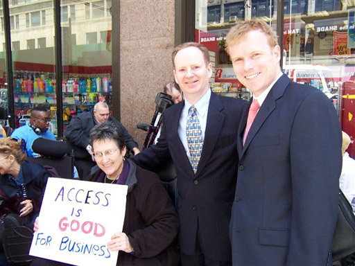 larger photo of Jean Ryan and two of the lawyers representing Disabled In Action