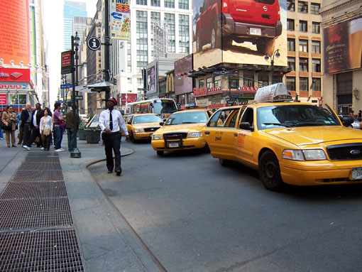 larger photo of a row of inaccessible New York City cabs