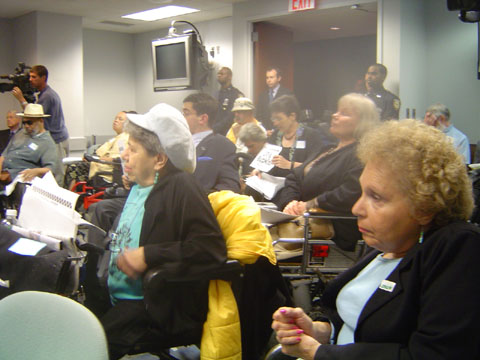 Photo of Frieda Zames, Carr Massi and others at TLC hearing in August 2004