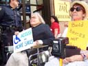 photo of Disabled In Activists carrying signs