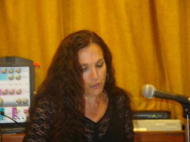 Nadina LaSpina at the microphone