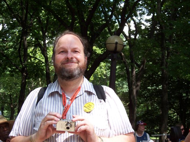 Philip Bennett holding a digital camera