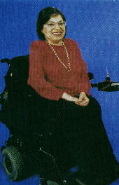 Judy Heumann in a power wheelchair