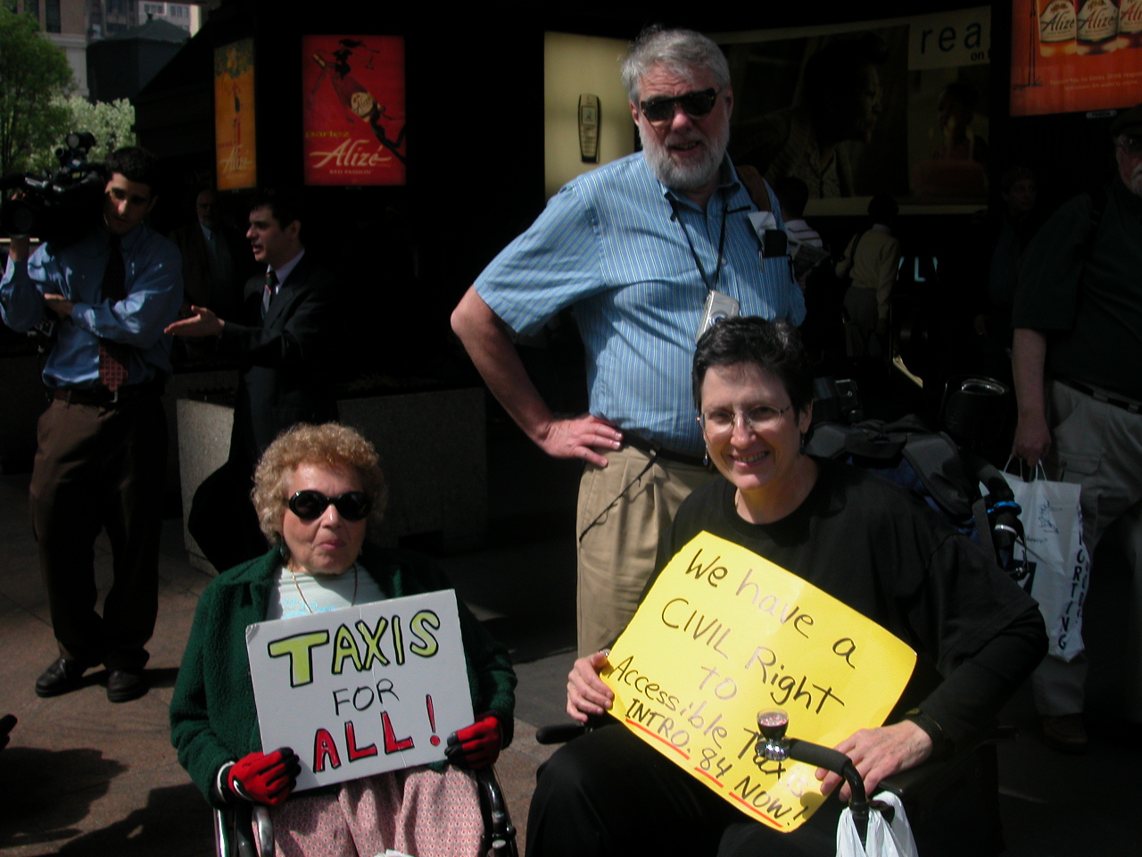 Carr Massi and Jean Ryan holding signs